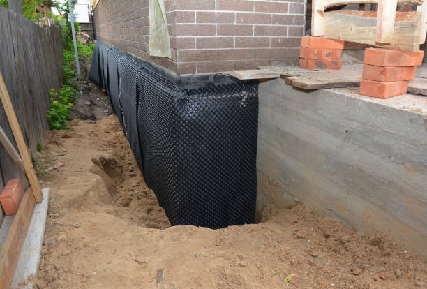 Happy homeowners after waterproofing job in Greensburg